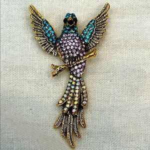 Elegant Gold and Blue Bird Brooch